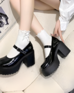 Black and white Chunky Mary Janes with a thick platform heel and ankle buckle. PU leather women's shoes.
