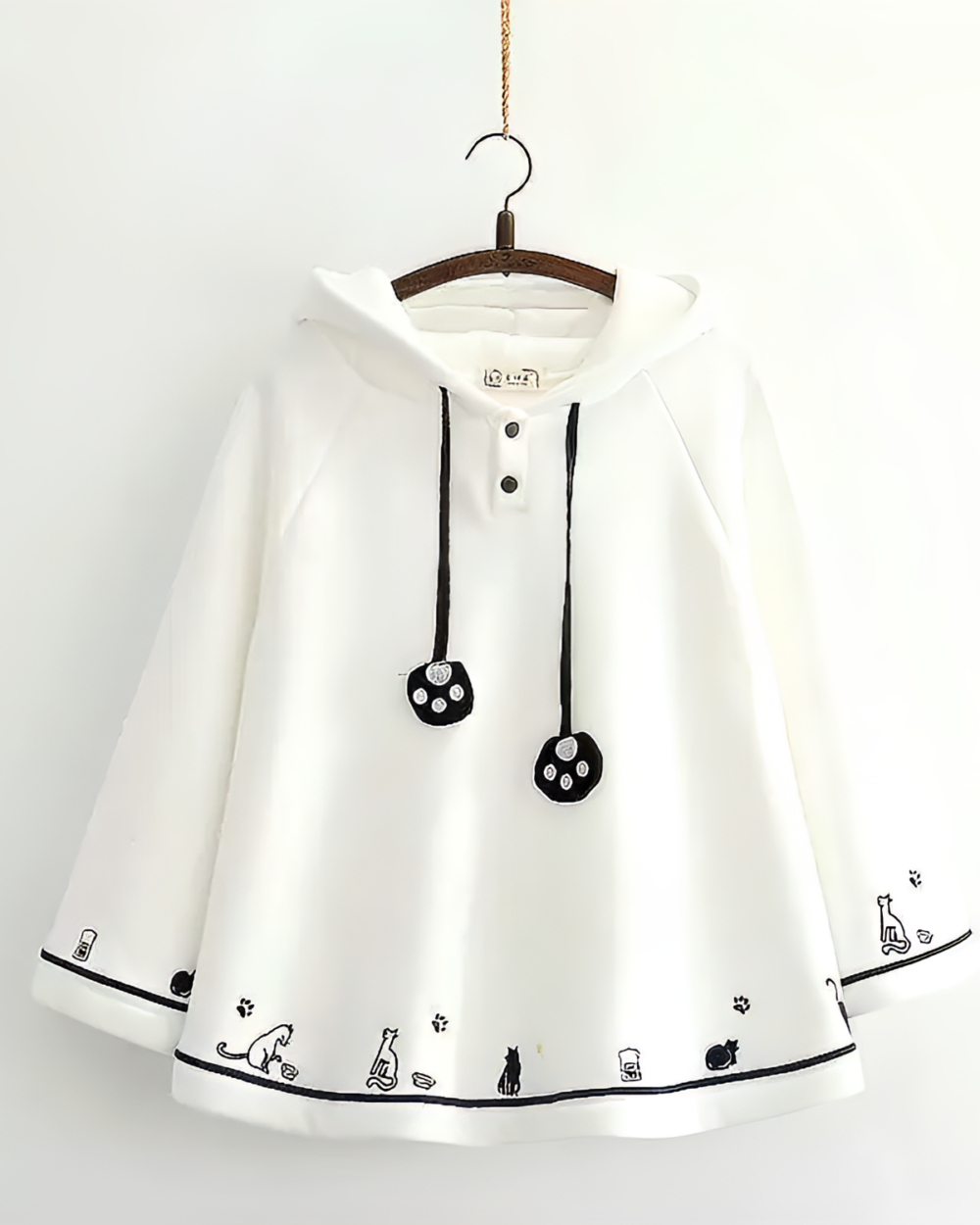 White Crescent Neko-Ear Hooded Poncho with cat paw and tail details. A cute and comfortable neko ear poncho.