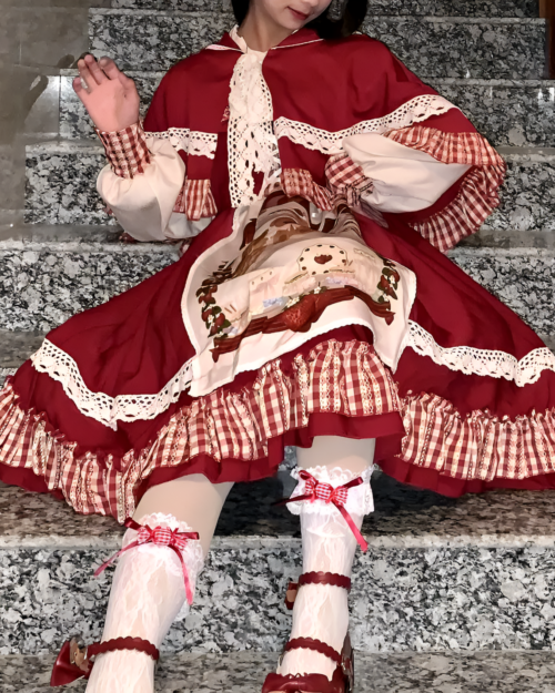Model wearing the Crimson Hood Berry Bear OP set featuring a red dress with white lace and a bear design, part of the Berry Bear OP collection.
