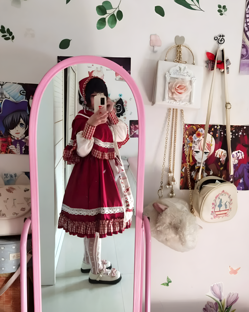 Model wearing the Crimson Hood Berry Bear OP set, featuring a red dress with lace details and matching bonnet. This Berry Bear OP is styled with a handbag.