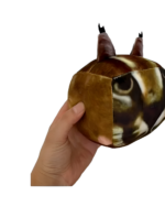 A brown Cube Floppa plushie is being held, showcasing its details and design.