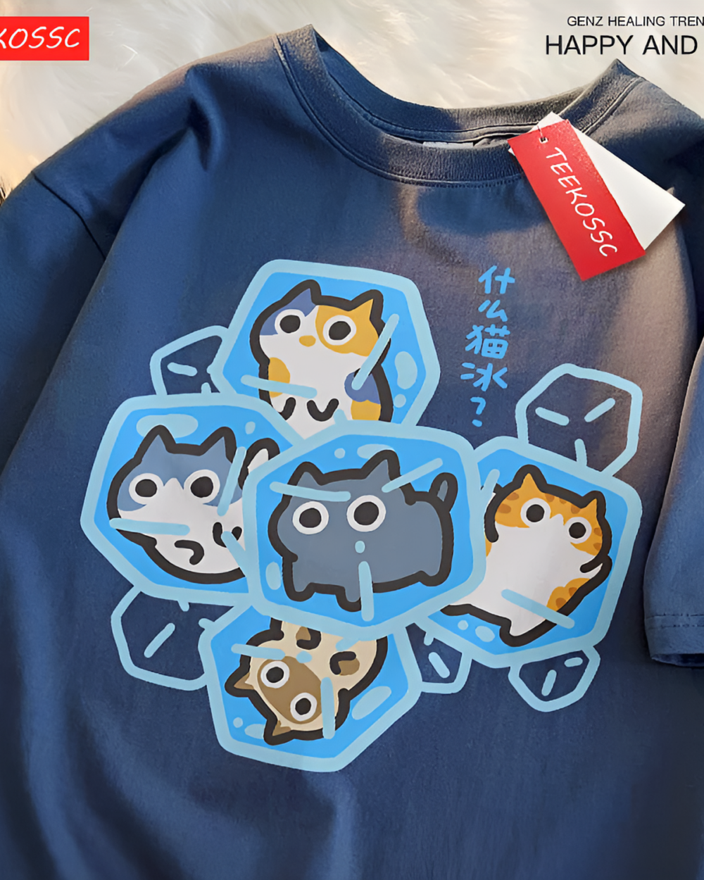 Close-up of a red cutecore cat shirt featuring a cartoon image of cats in ice cubes.