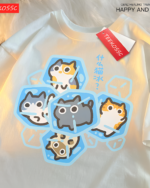 Cutecore cat shirt featuring an ice cube design with cute cat faces. White tee with colorful graphic print.