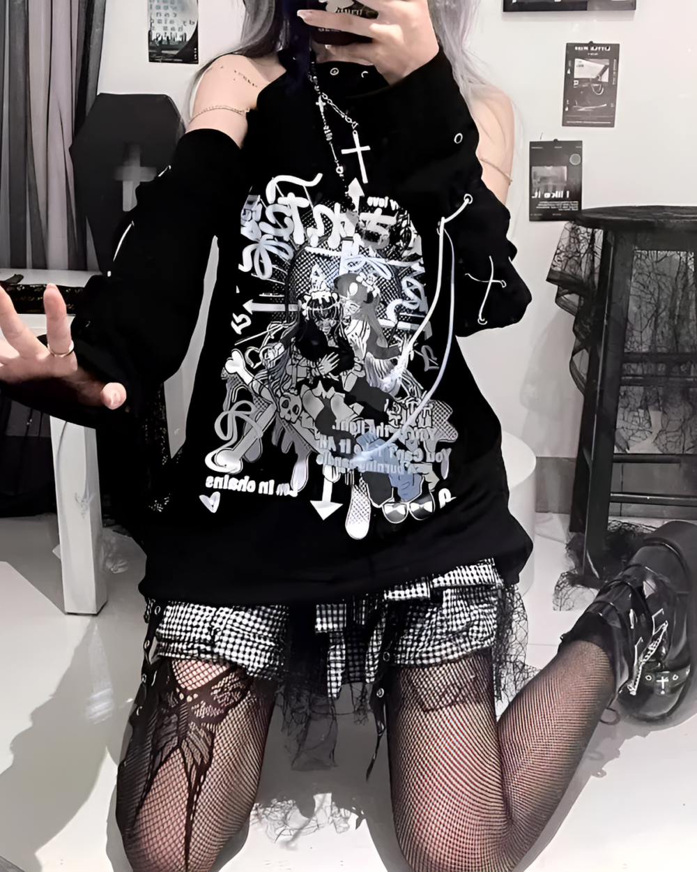 Model wearing a dark anime tee with a cold shoulder design and Kanji graphics. A stylish, black tee for anime fans.