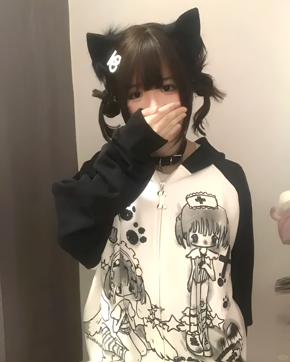 Person wearing a Dark Puppy Girl Hoodie with kawaii print and cat ears.