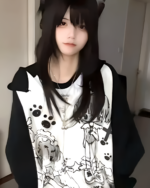 Person wearing a Dark Puppy Girl Hoodie featuring a print of cartoon dogs and paw prints.