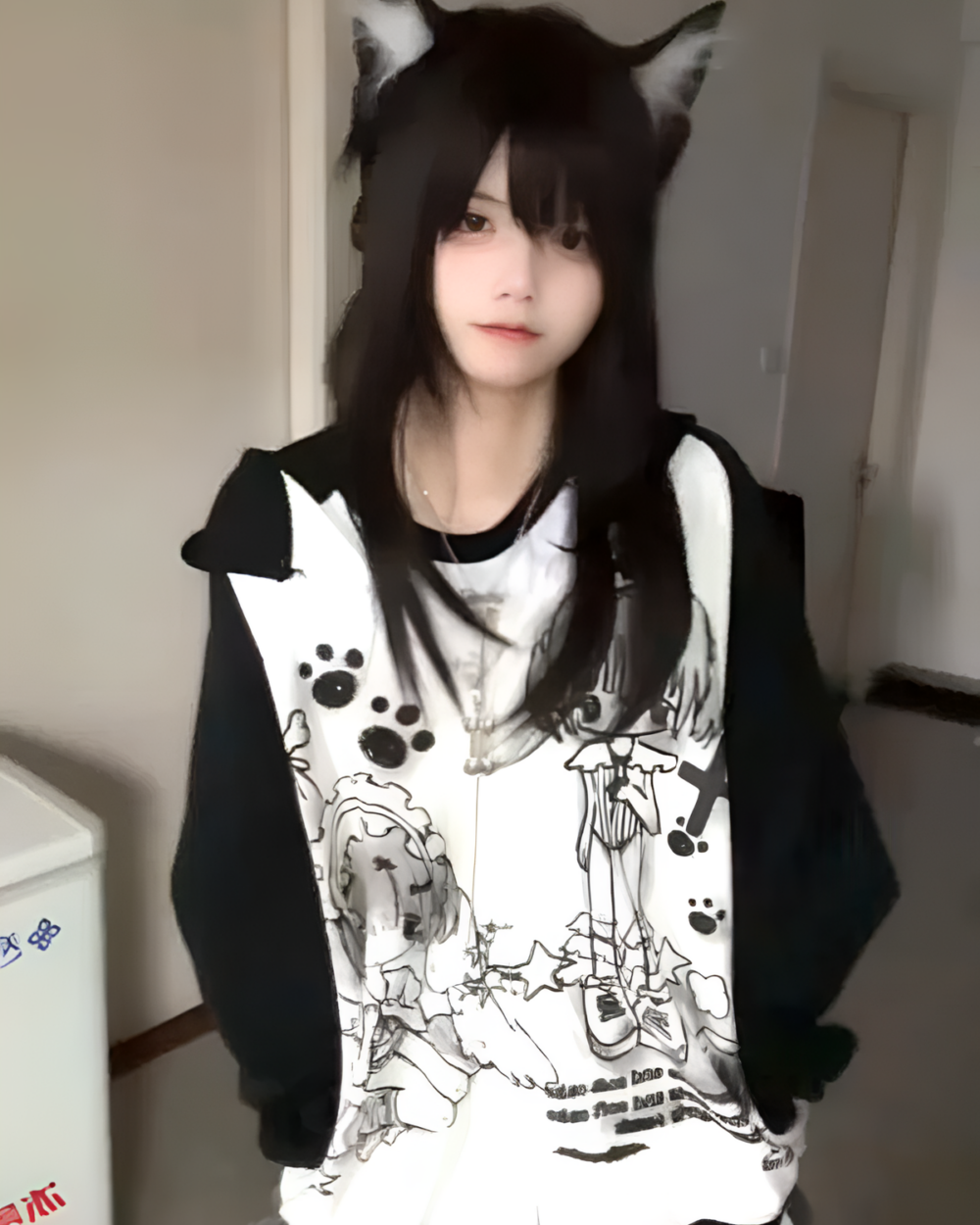 Dark Puppy Girl Hoodie featuring a print of kawaii pups and paws, worn as a sweatshirt.