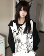 Dark Puppy Girl Hoodie featuring a print of kawaii pups and paws, worn as a sweatshirt.