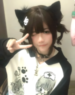 Person wearing a Dark Puppy Girl Hoodie featuring paw prints and a nurse design, with cat ears.