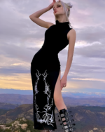 Model wearing a black Dark Turtleneck Goth Dress with floral embroidery and a side slit, outdoors.