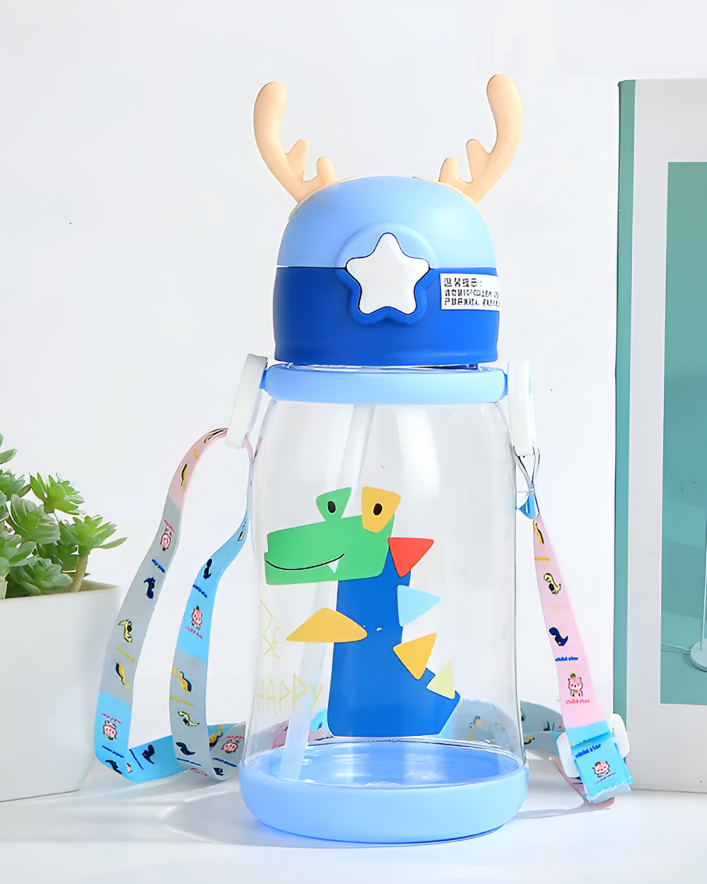 Blue deer antler water bottle with cartoon design and handle.