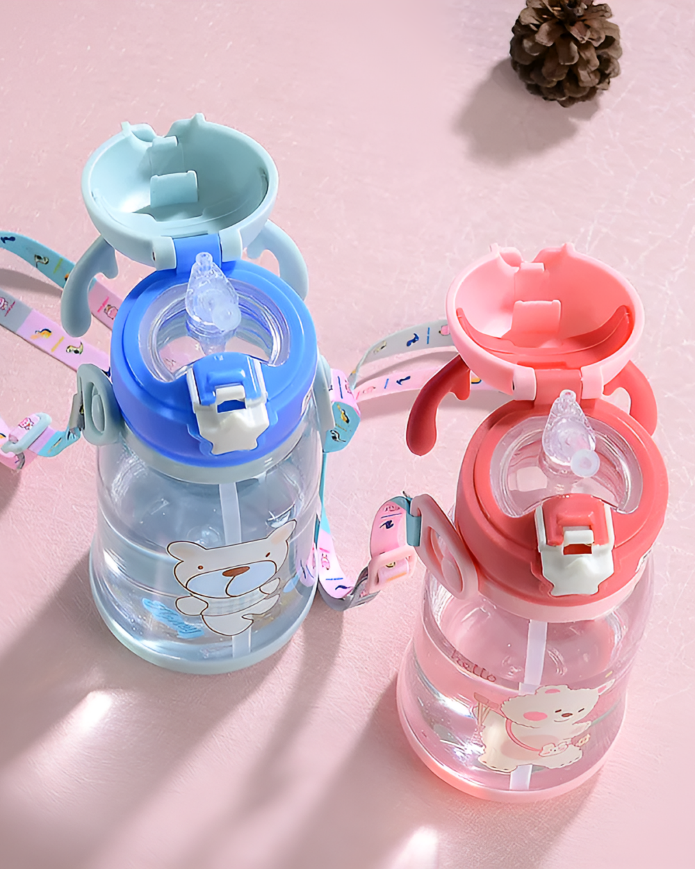 Set of colorful deer antler water bottles with straws and carrying handles.
