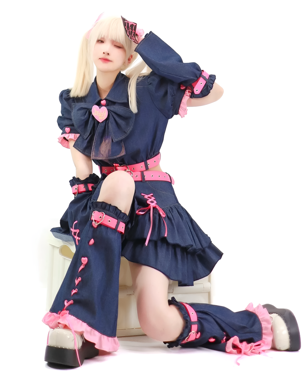 Denim Bittersweet Heart-Buckle Coord product photo 3 Model wearing the Denim Bittersweet Heart-Buckle Coord, a Y2K matching set with a navy blue denim skirt and top, pink accents, and heart details.