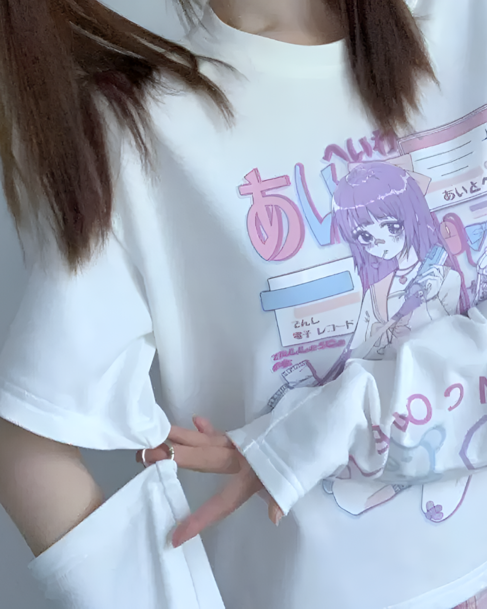 White detachable sleeves t-shirt featuring anime-inspired print and layered effect.
