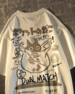 Close-up of a white Dual Match Neko Bag T-Shirt with a colorful graphic design featuring a cat and text.