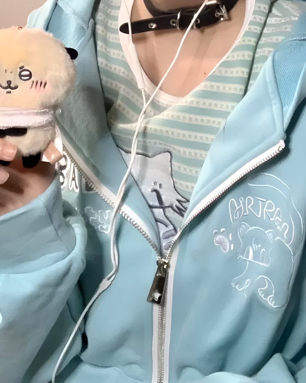 Light blue Eared Hoodie featuring a graphic of a bear and headphones.