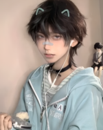 Person wearing an Eared Hoodie with cat ears and accessories.