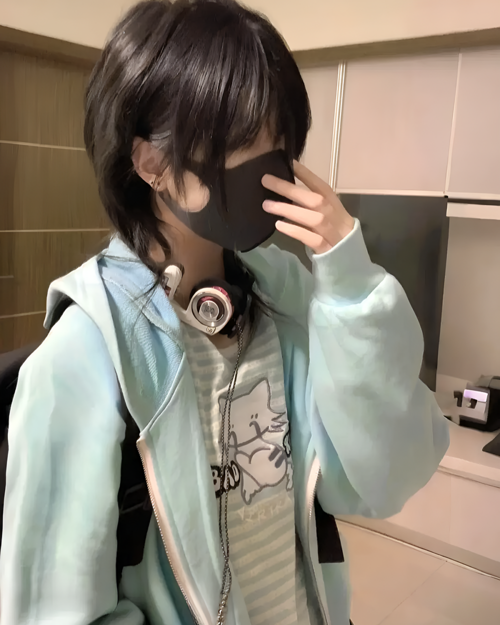 Person wearing a blue Eared Hoodie and face mask, Harauku Aesthetic style.
