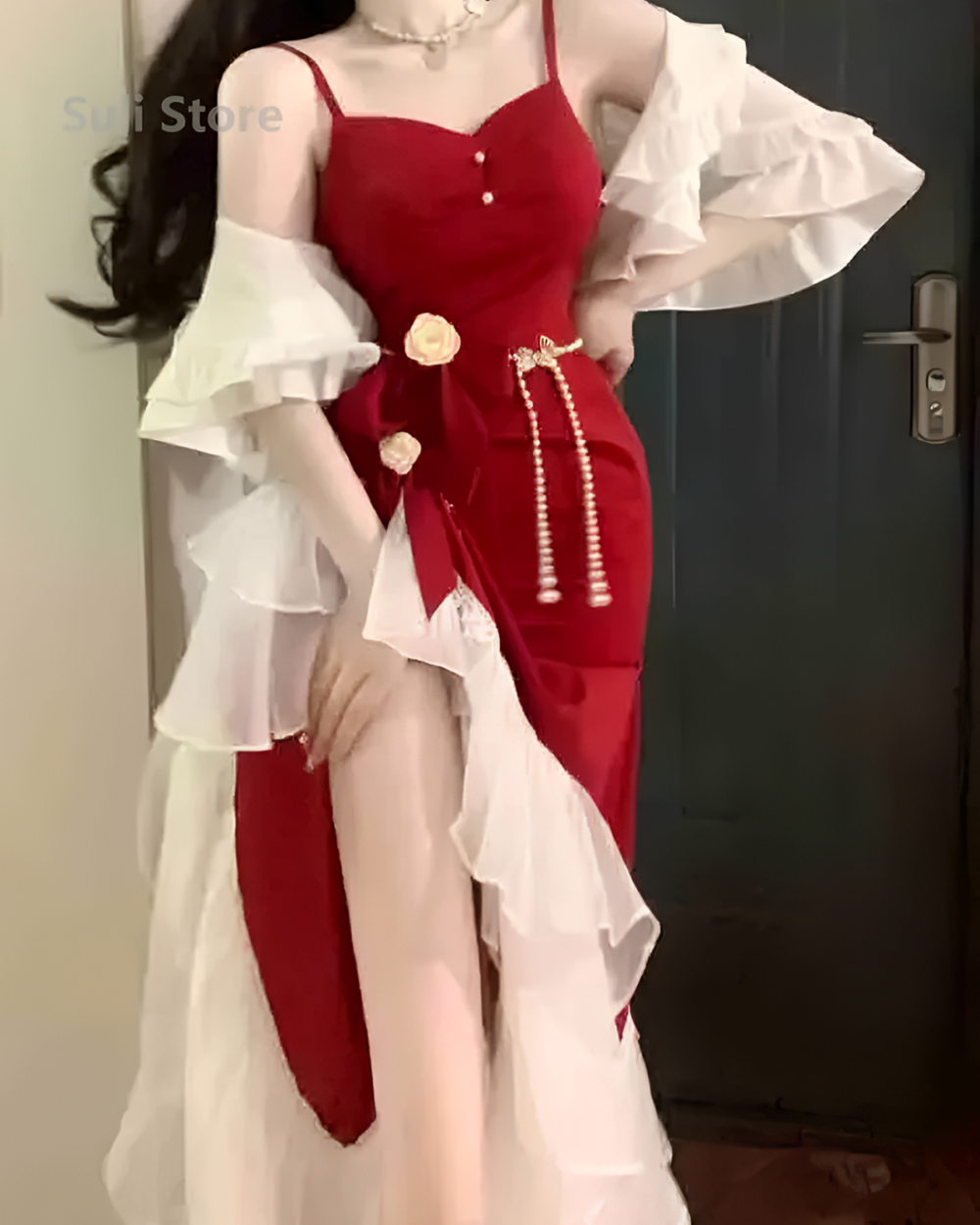 Red fairy midi dress with ruffled sleeves and pearl detailing.