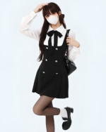 Black fake two-piece dress with a white shirt and bow, featuring a double-buttoned bodice.