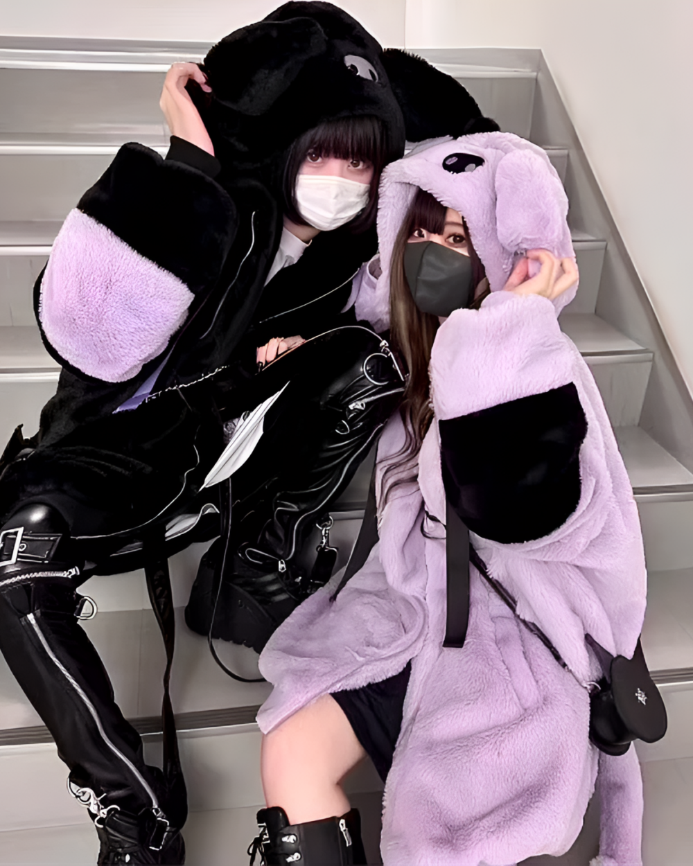 Two people wearing a Kuromicore aesthetic faux fur hooded coat, with matching ear covers and masks.
