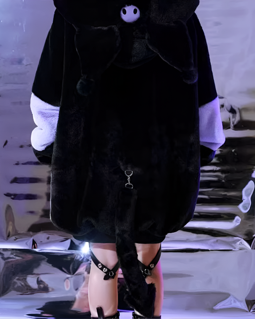 Black faux fur Kuromicore aesthetic hooded coat with bow detail.