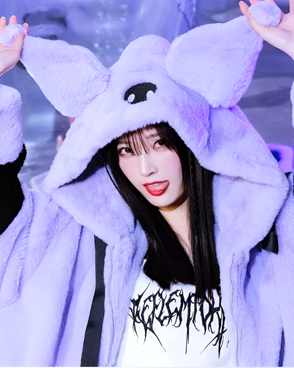 Person wearing a Kuromicore aesthetic faux fur hooded coat, featuring a plush purple design and hood.