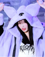 Person wearing a Kuromicore aesthetic faux fur hooded coat, featuring a plush purple design and hood.