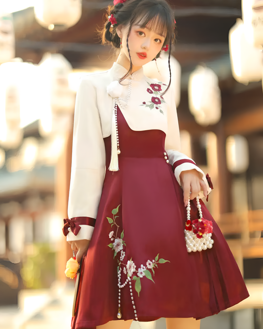 A Qi Lolita dress featuring a white and maroon floral design, with a high neckline and pearl accessories.
