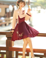 A burgundy Qi Lolita dress with floral embroidery, featuring a high-neck and long sleeves.