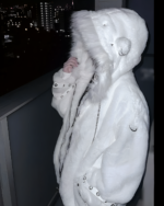 Person wearing a white Fluffy Bear Grommet Hoodie by Sabukaru Kei, featuring a furry hood and grommet details.