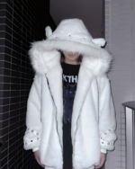 Person wearing a white Fluffy Bear Grommet Hoodie by Sabukaru Kei with a faux fur trimmed hood and grommet details.