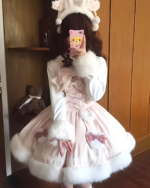 Person wearing a pink bunnycore dress with white fur trim and accessories.