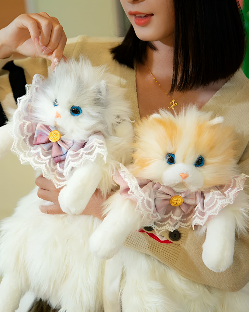 Two Fluffy Chonker Bags, plush cat backpacks, displayed with hands.