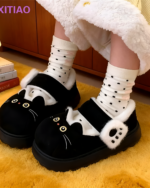 Black Fluffy Mary Jane slippers with a cat face design and polka dot socks.