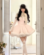 Model wearing a fluffy pink sweet lolita dress with long sleeves and a heart-shaped neckline, paired with white thigh-high socks.