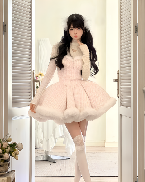 Model wearing a fluffy pink sweet lolita dress with long sleeves and a heart-shaped neckline, paired with white thigh-high socks.