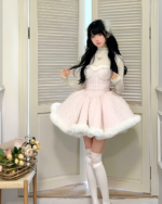 Model wearing a fluffy pink sweet lolita dress with white fur trim and long sleeves. A winter aesthetic.