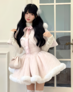 Model wearing a pink sweet lolita dress with fur trim and headband, presenting a winter aesthetic.