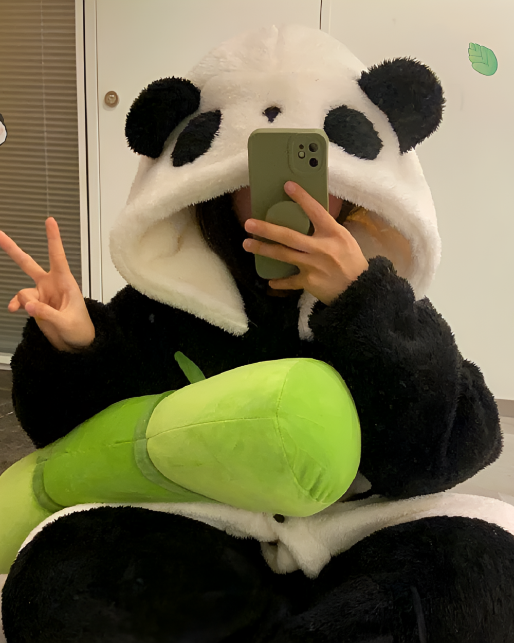 Person wearing a panda Fluffy Kigurumi robe and taking a selfie. Cozy and comfortable Fluffy Kigurumi for all ages.