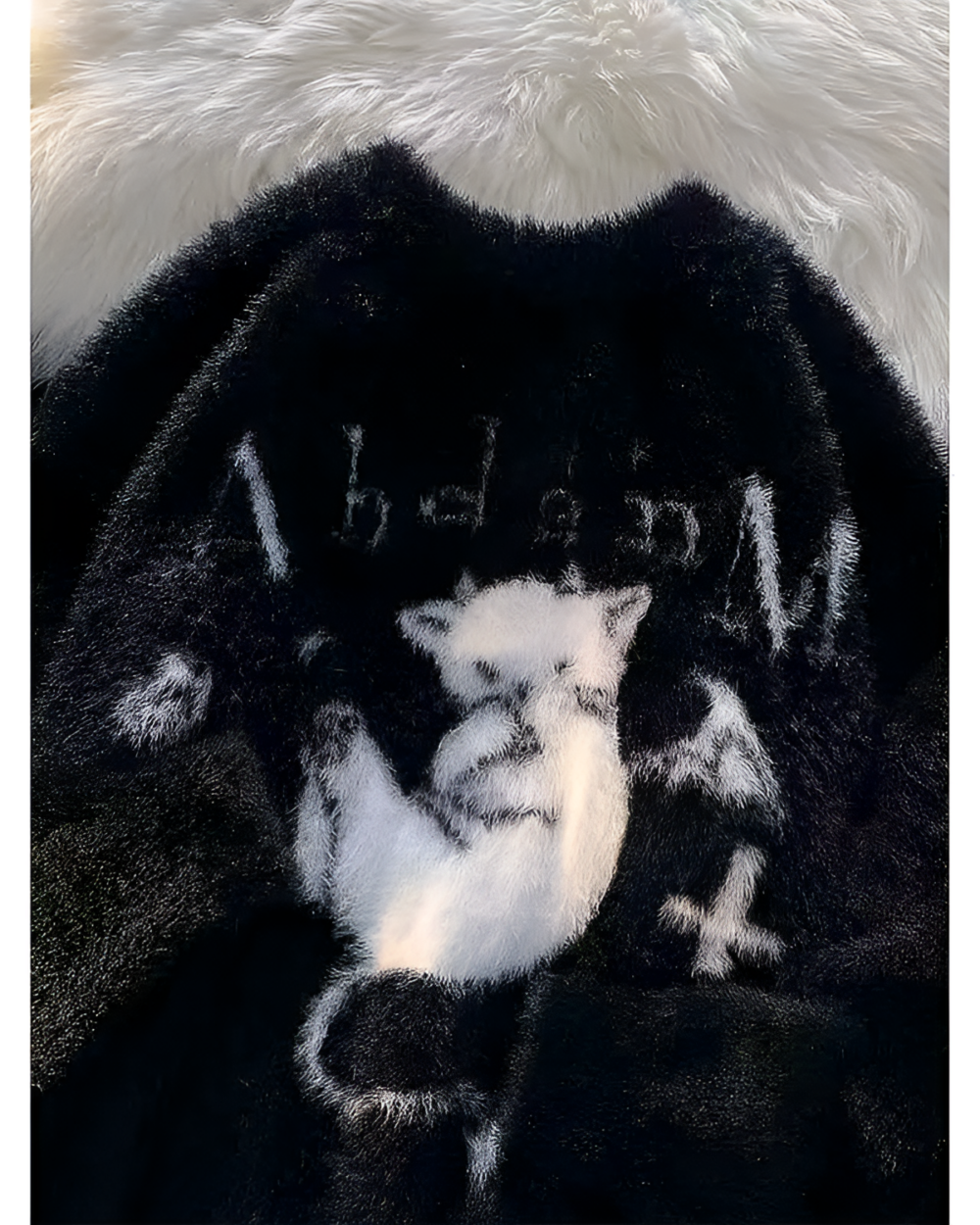 Black Gothic fluffy sweater with a cat graphic.