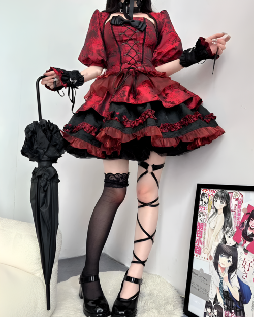 Red Gothic Lolita dress with lace trim, corset, and black accessories.