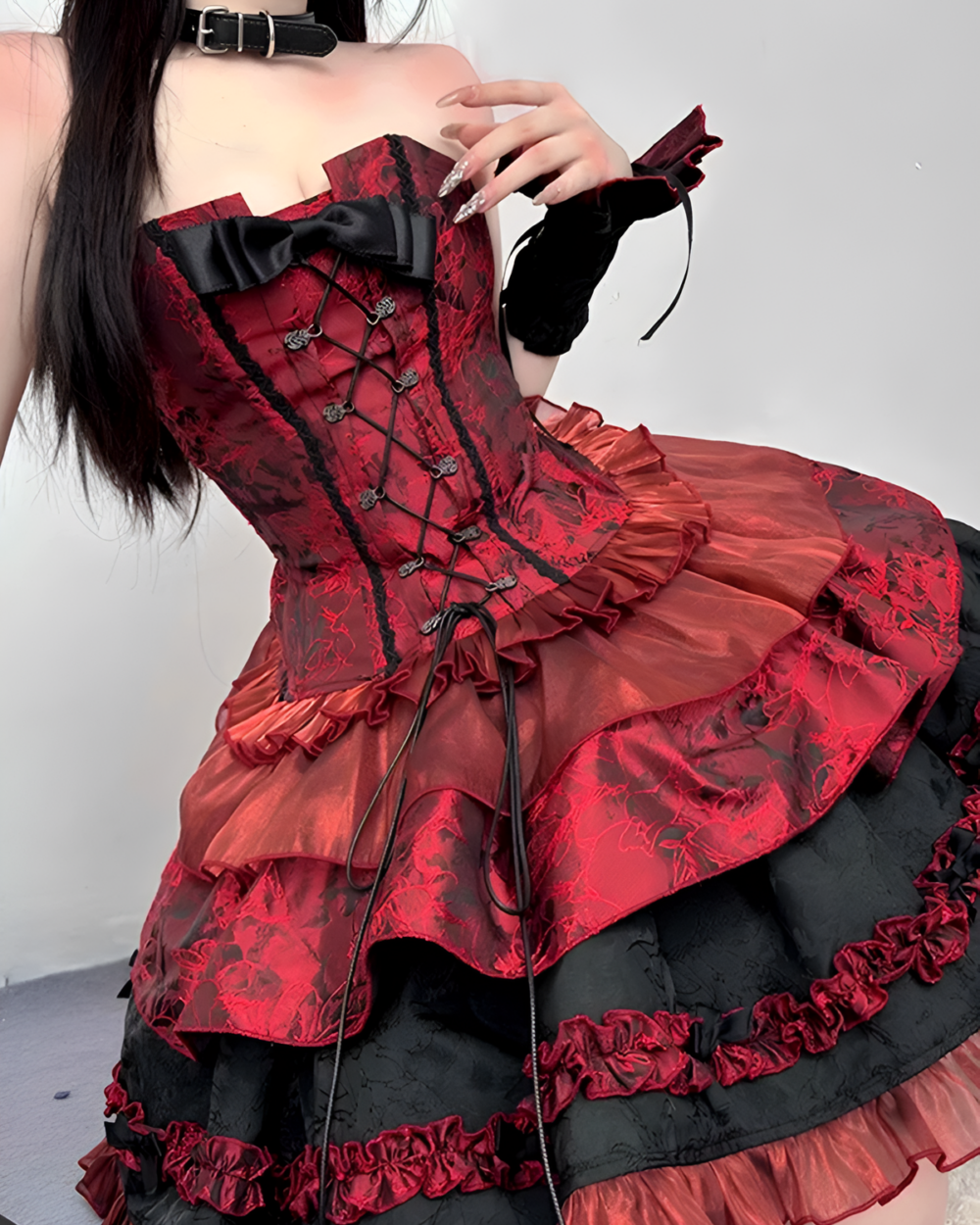 Close-up of a red Gothic Lolita dress - Vampirecore Edition with intricate lace detailing and a corset top.