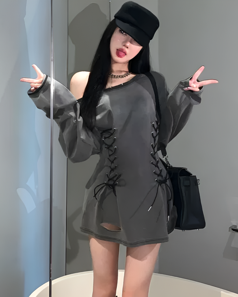 Woman wearing a Grunge-Style Dress, gray oversized shirt with lace detailing, off-shoulder style.