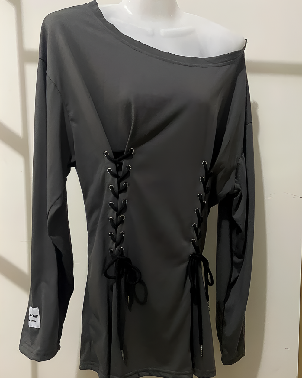 Black Grunge-Style Dress featuring lace-up detailing and long sleeves.