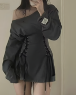 Close-up of a black Grunge-Style Dress with lacing details, showcasing its oversized fit.