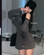 Grunge-Style Dress in grey worn by a model, featuring a layered look and tie details.