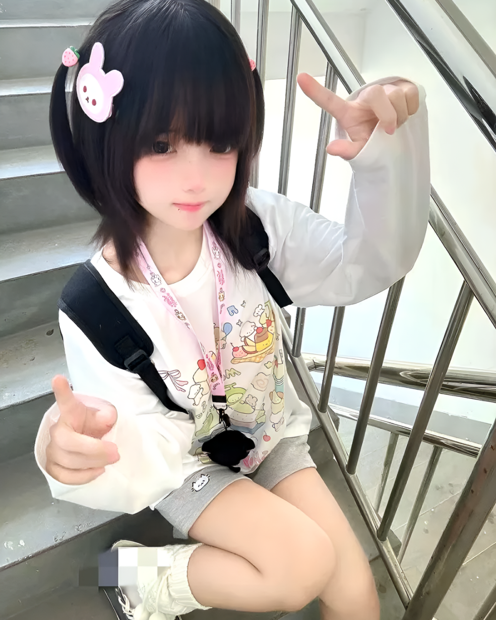 Person wearing a Harajuku Desserts T-Shirt with a kawaii design, posing on stairs.