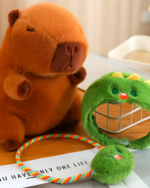 Close-up of brown and green Hatted Capybara Plushies with a colorful strap, designed as a squeaky purse.