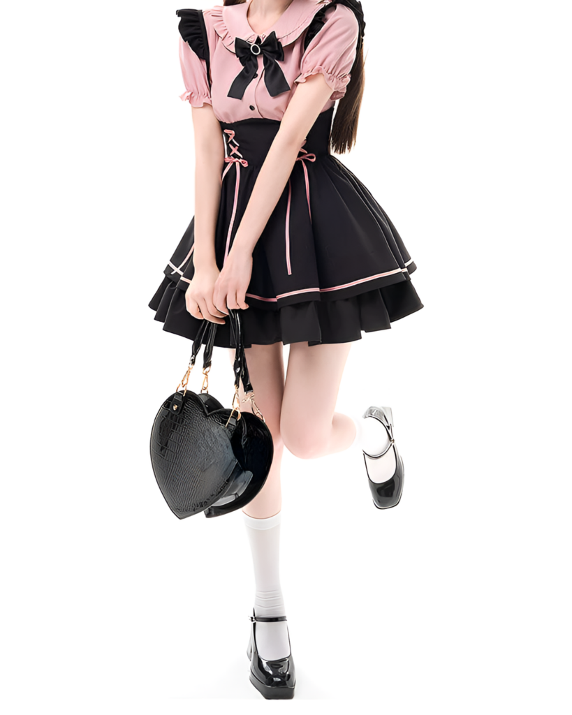 Model wearing a Heartache Lace-Up Pinafore Coord, a Jirai Kei outfit with pink and black color scheme. Includes a handbag.